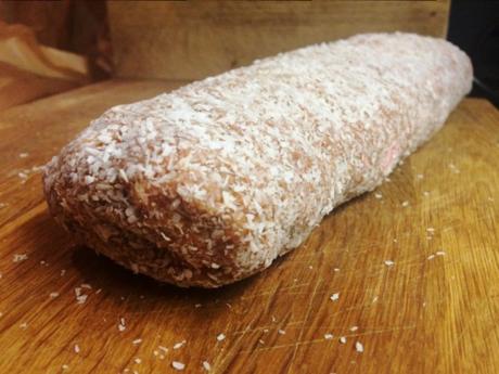 finished lolly cake log covered in desiccated coconut ready to eat