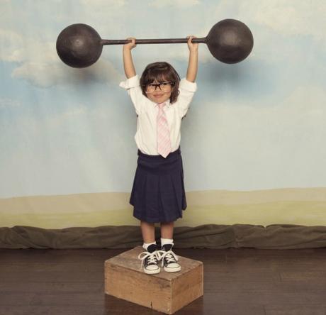 little girl lifting barbell