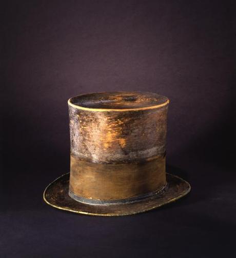 Wide-brimmed, tall top hat with band around it