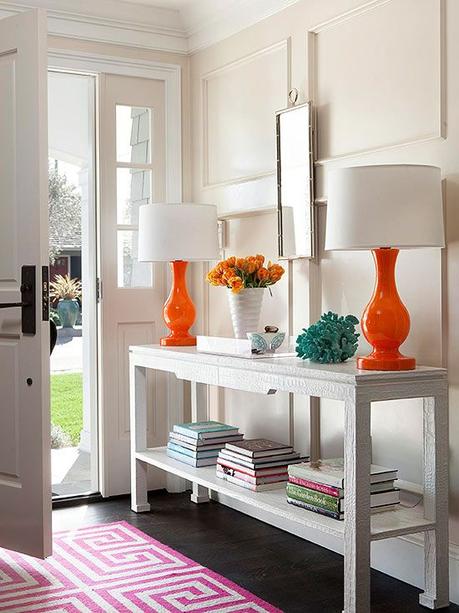 Finding Balance in your Home Decor white croc console + pair of vivid orange lamps