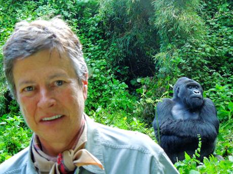 Susan Eckert with a male silverback gorilla on a gorilla trek in Uganda.