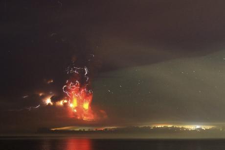 Smoke and lava spew from the Calbuco volcano, as seen from the shores of Lake Llanquihue in Puerto Varas