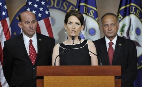 Republican candidate for president U.S. Representative Michelle Bachmann (R-MN) (C) holds a news conference with Representative Louie Gohmert (R-TX) (L) and Representative Steve King (R-IA) (R) to discuss the debt ceiling and military benefits, at the U.S