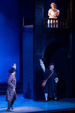 The balcony scene: Leporello (Adam Lau) pretends to woo Donna Elvira (Hailey Clark) as the Don (Jeongcheol Cha) coaches him