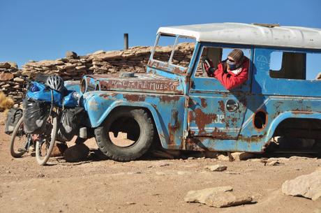 Kevin riding an old car he found at one of the abandoned mining villages.