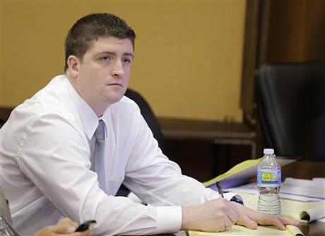 In this April 9, 2015, file photo, Cleveland police Officer Michael Brelo listens to testimony during his trial in Cleveland.