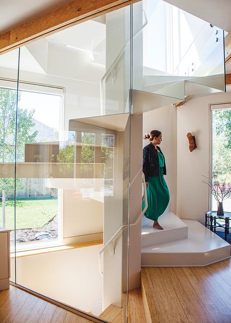 Modern prefab modular and triangular home by HOMB in Portland glass enclosed spiral staircase hexagon