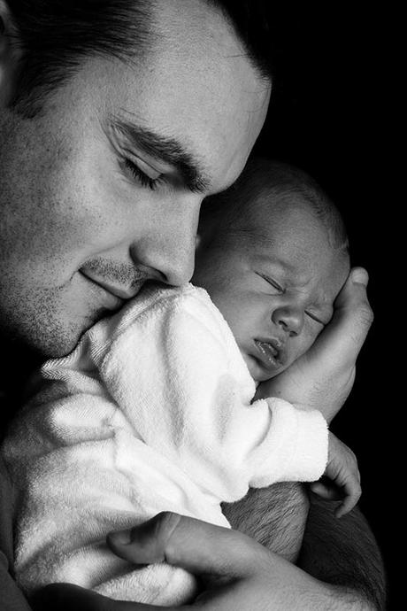 Having kids is not just a woman’s issue! A father with his new born baby.