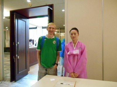 Staying at the 5 Star Yanggakdo Hotel in Pyongyang, North Korea With one of the staff at the Yanggakdo Hotel