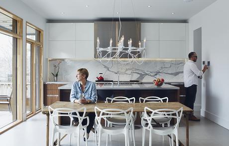 Modern Toronto kitchen and dining table outfitted with smart home technology