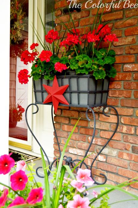 July 4th: History, Fun, Family and Some Recipes red geraniums and a red star for the entry on the 4th of July