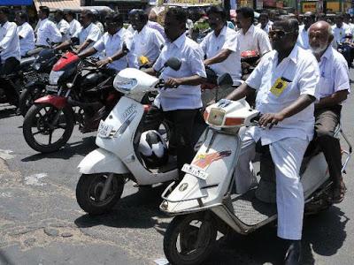 Section of Madurai Advocates defy helmet rule - protest by holding rally