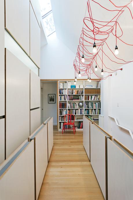 lighting-up-toronto-tudor-second-story-hallway-open-office-library-hanging-fixtures-made-from-ikea-extension-cords Halllway interior with red cord ceiling light