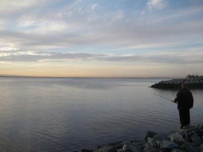 100 Places I Backpacked Through That You’ve Never Heard Of, in Australia Sunset with a fisherman at Scarborough