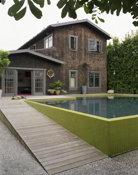 Modern pool house with seeded concrete walkway