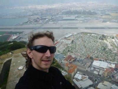 Backpacking in Gibraltar: Top 10 Sights at the Top of the Rock Looking down at the border between Gibraltar and Spain