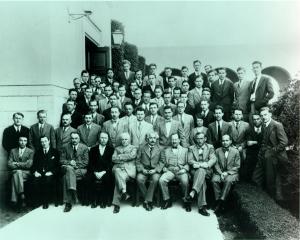 Group photo of Caltech Physics faculty and graduate students, taken on the occasion of a visit to Pasadena by Albert Einstein, 1931. Robert Oppenheimer sits in the front frow, far left.