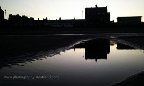 Photo - buildings on the front at Porobello, reflected in water on the shore, Edinburgh, Scotland