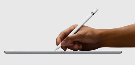 A hand using the Apple Pencil on the iPad Pro