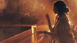 girl alone at the bar, girl smoking, hazy picture, S.C Rhyne