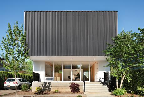 Affordable Portland home upper floor wrapped in black corrugated steel