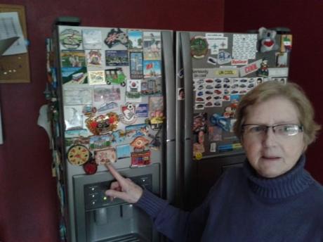 Travel Collectables: 10 Things I Try to Do in EVERY Country My Mum with some of her collection of fridge magnets from around the world.