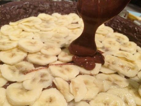 pouring chocolate caramel banana layered pie