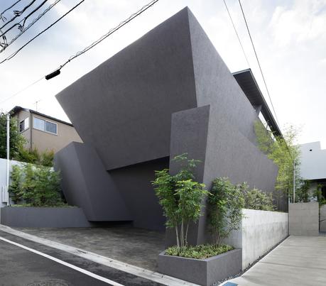 Concrete planters adjacent facade of tokyo home by Artechnic.