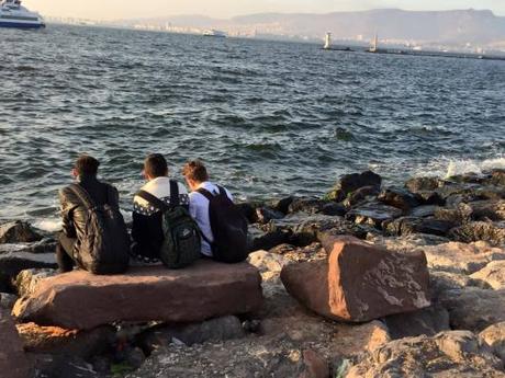refugees waiting by the sea