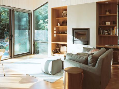 This Tiny New England Cottage Is a No-Frills Weekend Hideaway Modern small space Rhode Island cottage with douglas fir flooring and Morsø stove