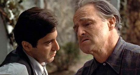 Michael (Al Pacino) listens to his father (Marlon Brando)