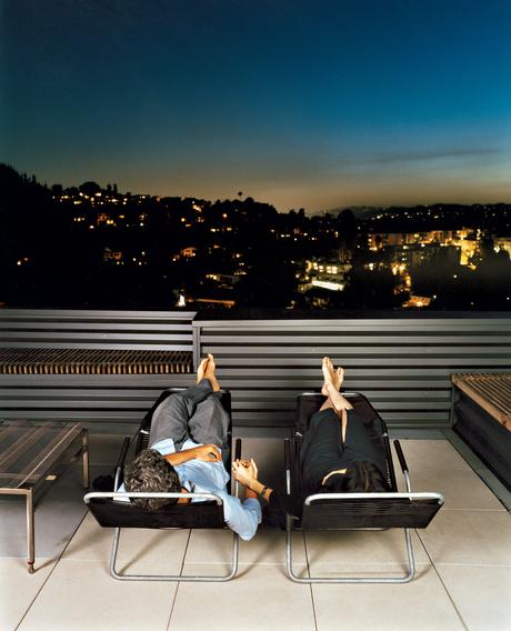 day-hachigan-exterior-balcony Joe Day and Nina Hachigian relax on their terrace overlooking the hills in Silver Lake area of Los Angeles.