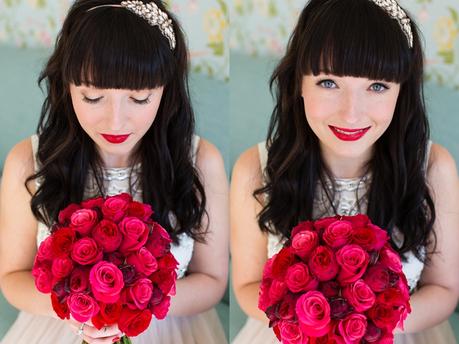 Bride with black hair and red lipstick holding red roses Langar Hall Wedding Photography