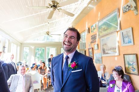 Langar Hall Wedding Photography groom smiling as he waits for bride