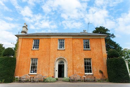 Langar Hall Wedding Photography Exterior of building with teracotta paint