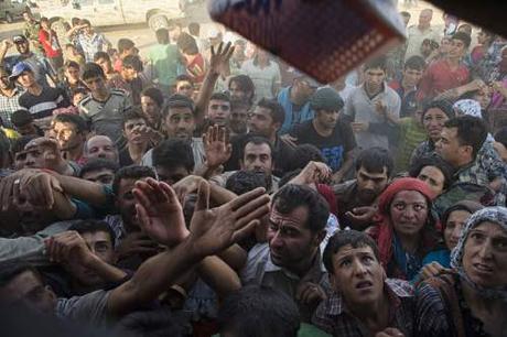 8 Syrians caught sneaking across U.S.-Mexico border. Obama threatens to veto refugee-vetting bill Syrian refugees (Photo credit: Lynsey Addario/NYT)