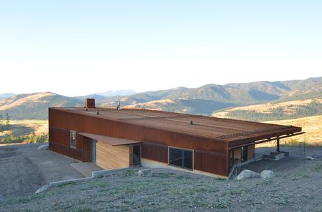 Weathering steel, glass, cedar facade of cabin by Johnston Architects in Washington State. 