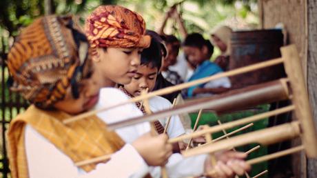 Children practice the angklung
