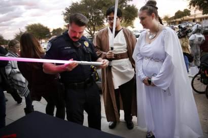 A light saber is inspected outside a Texas theater.