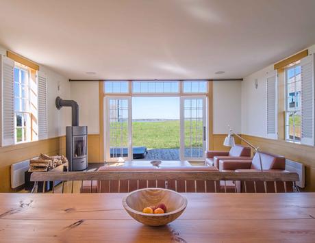 Schoolhouses Turned into Modern Homes Chebogue Schoolhouse living room with window overlooking the ocean