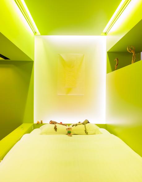 Neon green and yellow bedroom of Antwerp bedroom.