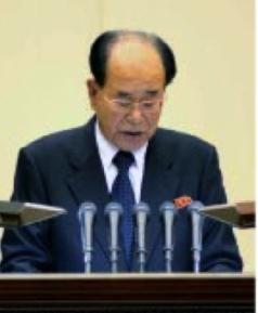 Central Report Meeting Commemorates KJI’s Birth Anniversary SPA Presidium President Kim Yo'ng-nam delivers the report at a February 15, 2016 national meeting to commemorate the birth anniversary of Kim Jong Il (Photo: Rodong Sinmun).