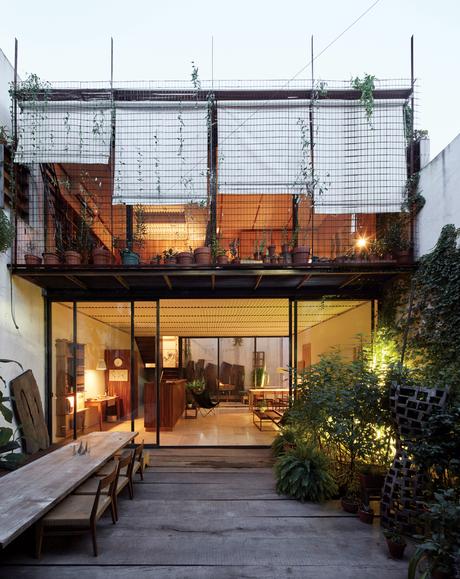 The second floor overlooks the patio at the front of the house. 