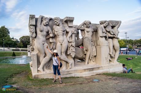 Posing with statues in Paris France