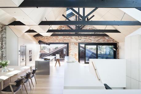 Renovated warehouse with exposed structure and ample skylights.