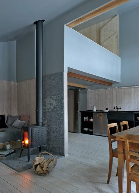 Swiss family getaway small space renovation with stove in main room