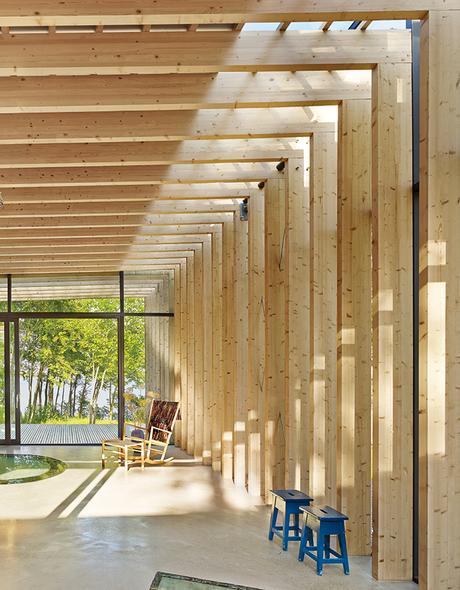 How a 1,000-Year-Old Technique Made This Pavilion Swedish guesthouse living room with timber pergola