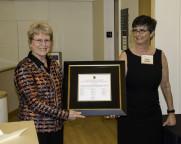 Jane Lubchenco receiving the Pauling Legacy Award certificate from Faye Chadwell, University Librarian and Director of the OSU Press.