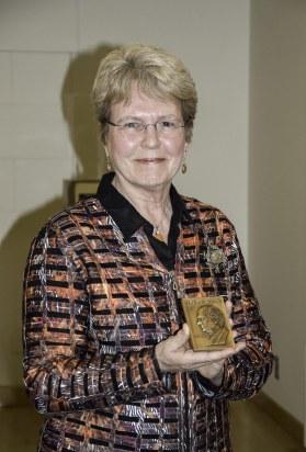 Lubchenco posing with the Pauling Legacy Award medal.