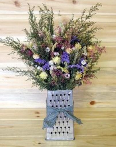 Top 10 Ways To Recycle and Reuse Cheese Graters Cheese Grater Transformed Into a Flower Vase